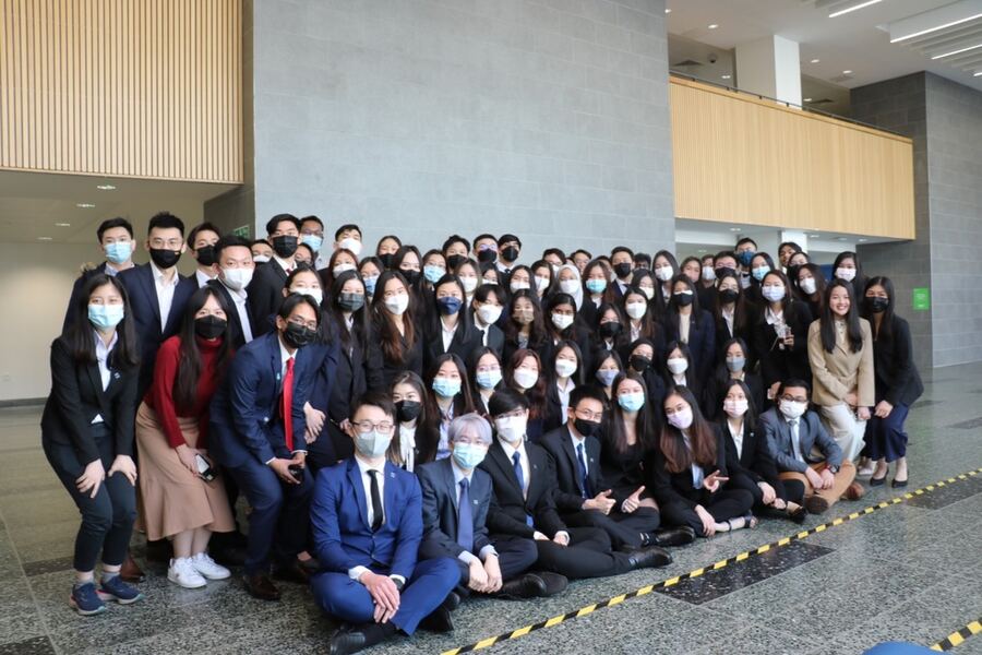 Large group of Malaysian scholars in business attire